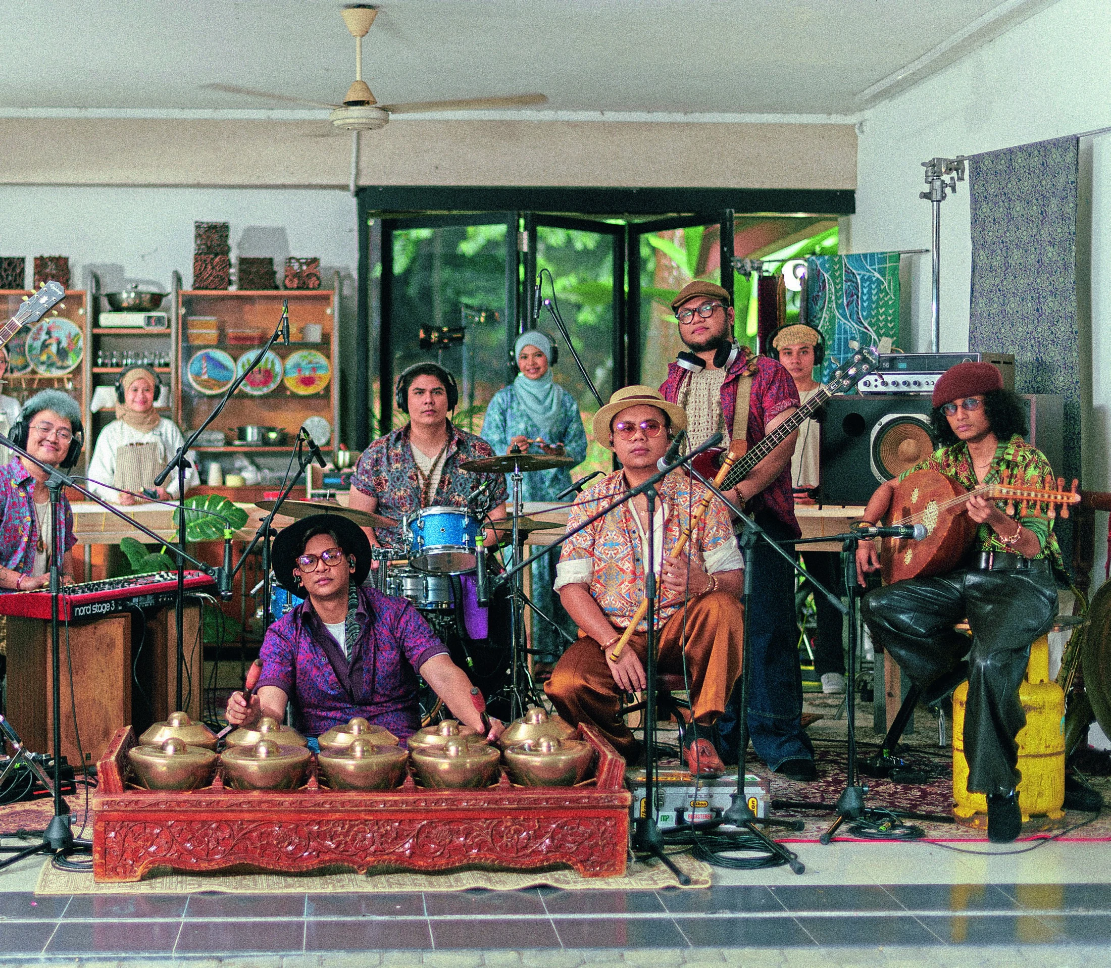 Musicians and textile artisans gather in colourful batik clothing for the ORKES collection
